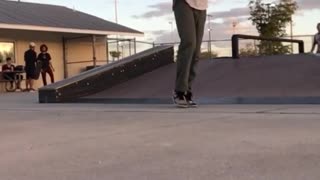 White shirt skateboarder lands hip