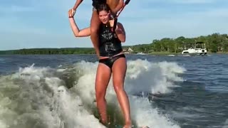 Waterskiing While Perched on Shoulders