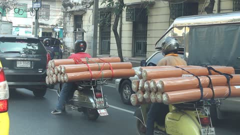 motorcycles carrying huge loads