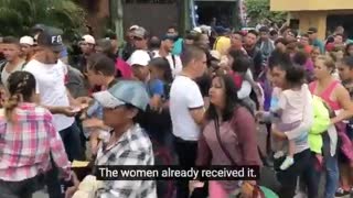 Caravan Members Being Handed Something