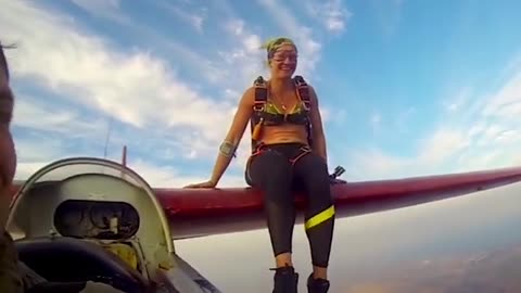 Woman Skydives Off the Wing of A Glider
