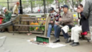 Old People Plays Music In Streets Corner