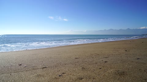 A Beautiful Beach With View Of Horizon