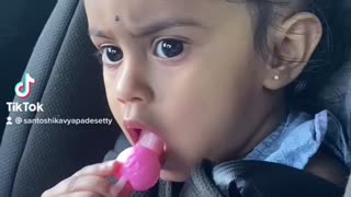 Cute baby eating candy