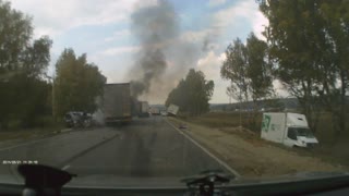 Vehicle Accident Creates Flames on Russian Roadway