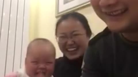 Cute Baby Laughs at Dad Counting Money