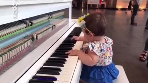 Baby playing piano