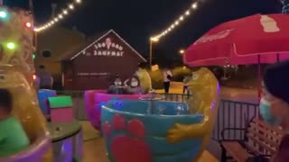 Siblings playing at carnival game-fairground