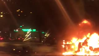Flaming Car in the Street Combusts