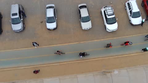 Footage Drone recording people near the beach.