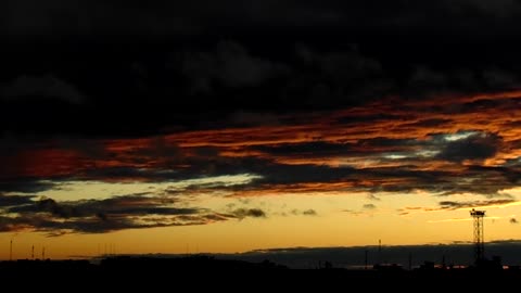 Unusual sunset against the background of thunderclouds