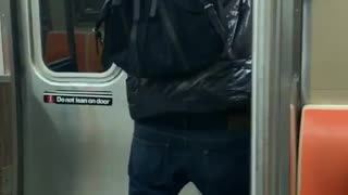 Guy dancing on the subway