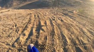Pov camera, guy jumps off a ramp on dirtbike and falls down