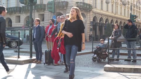 Cute Female Tourist Crossing The Street Near Some Traffic Lights