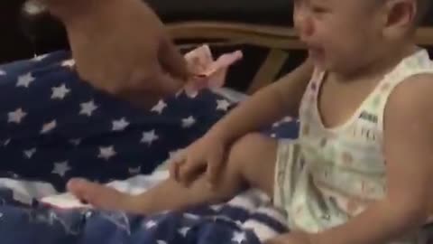 Funny!!Baby doesn't want a piece of money