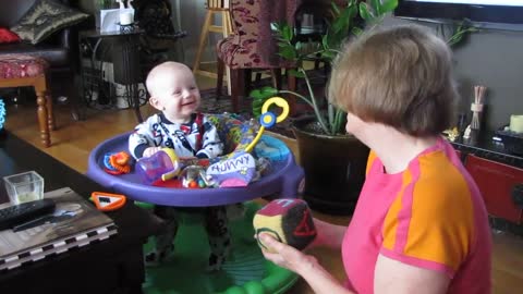 Baby Bodhi laughing at Grammie's block