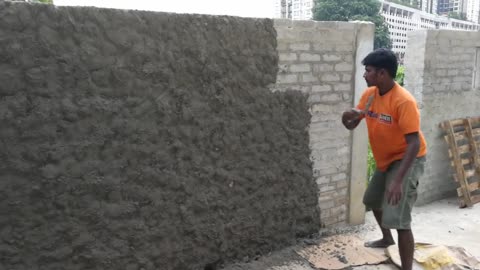 India style of plastering a wall
