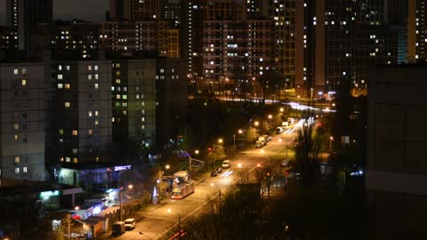 Time-lapse photography of vehicles passing through the streets at night