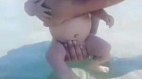 Lovely baby try to Swiming With Dad. New Born baby Most Beautiful baby in the world