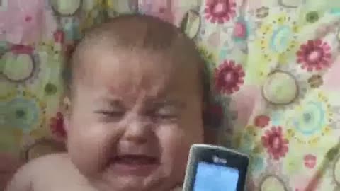 Cute baby is scared to hear baby laughing voice