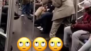 Man throws dice on the floor of subway train
