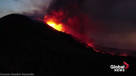 La Palma volcano- Drone shows inside of flaming crater as eruptions continue