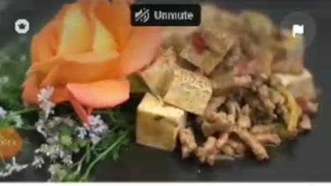 Tasty Tofu fry with meat decorated with orange flower