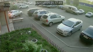 Car Reverses Over Unsuspecting Pedestrian
