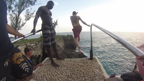 Jumping from the cliff at Rick's Cafe in Jamaica