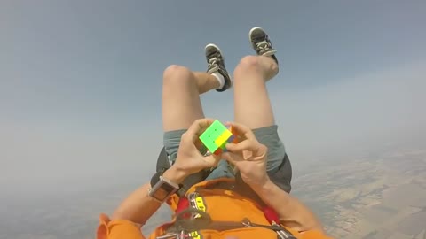 Skydiver Solves Rubik's Cube While Free-Falling