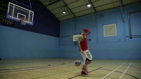 Guy Arm Rolls Basketball Then Lands Backheel Basketball Kick Back Turned