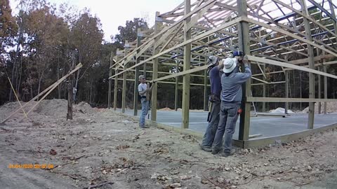 Bracing the trusses, nailing up girts