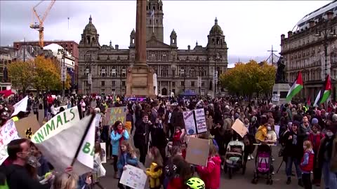 Protesters stage conga line at COP26 climate march