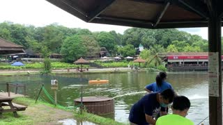 People Fishing on the Pond