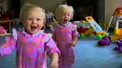 Twin Babies Have Fun With Leaf blower