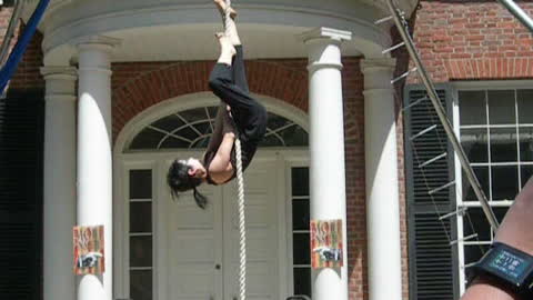 Woman performs aerial rope routine