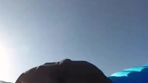 Crazy fast skydiver goes through a sign like it is nothing