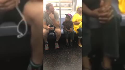 Subway Passenger Lets Adorable Little Boy Play On His Phone