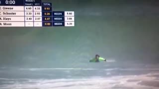 Tv footage of a pro surfer wiping out in a wave