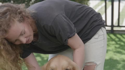 Woman Petting a Dog