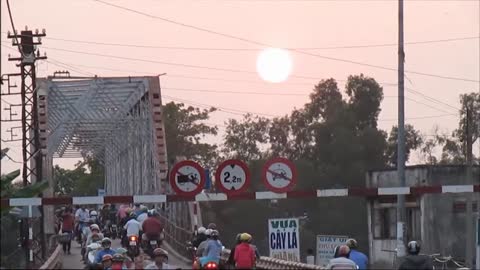Vietnam, Bình Dương, Thuận An - motorbike bridge at sunset - 2014-03