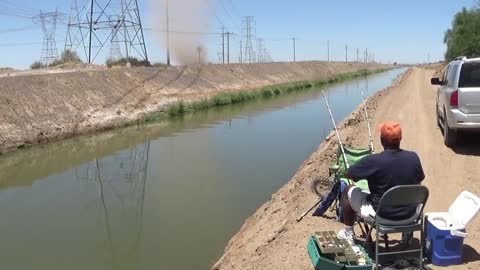 Dust Devil Blows into Fisherman