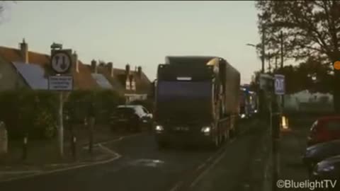 NUCLEAR MILITARY CONVOY ON THE MOVE THROUGH QUITE ENGLISH VILLAGE
