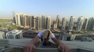 Man Performs Some High-Rise Stunts