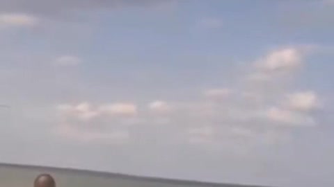 Russian strike Mi-28N and transport Mi-8AMTSh pass over the coast in the Kherson region.