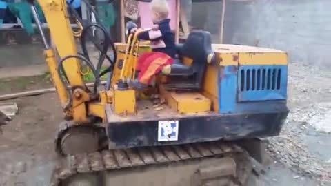 Albanian Baby boy drive big machines Like a Pro