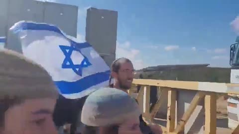 Israelis gather around the Kerem Shalom border crossing on a daily basis