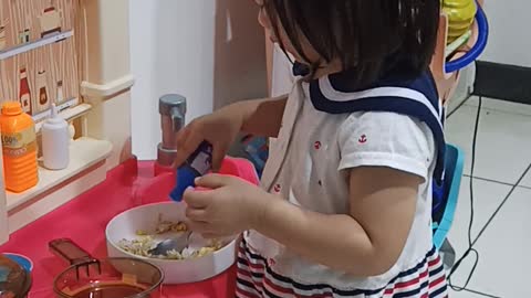 Baby Pretends to Put Sauce to A Real Food