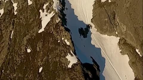 Snow covered mountains and trees