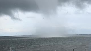 Massive waterspout forms alarming close to house